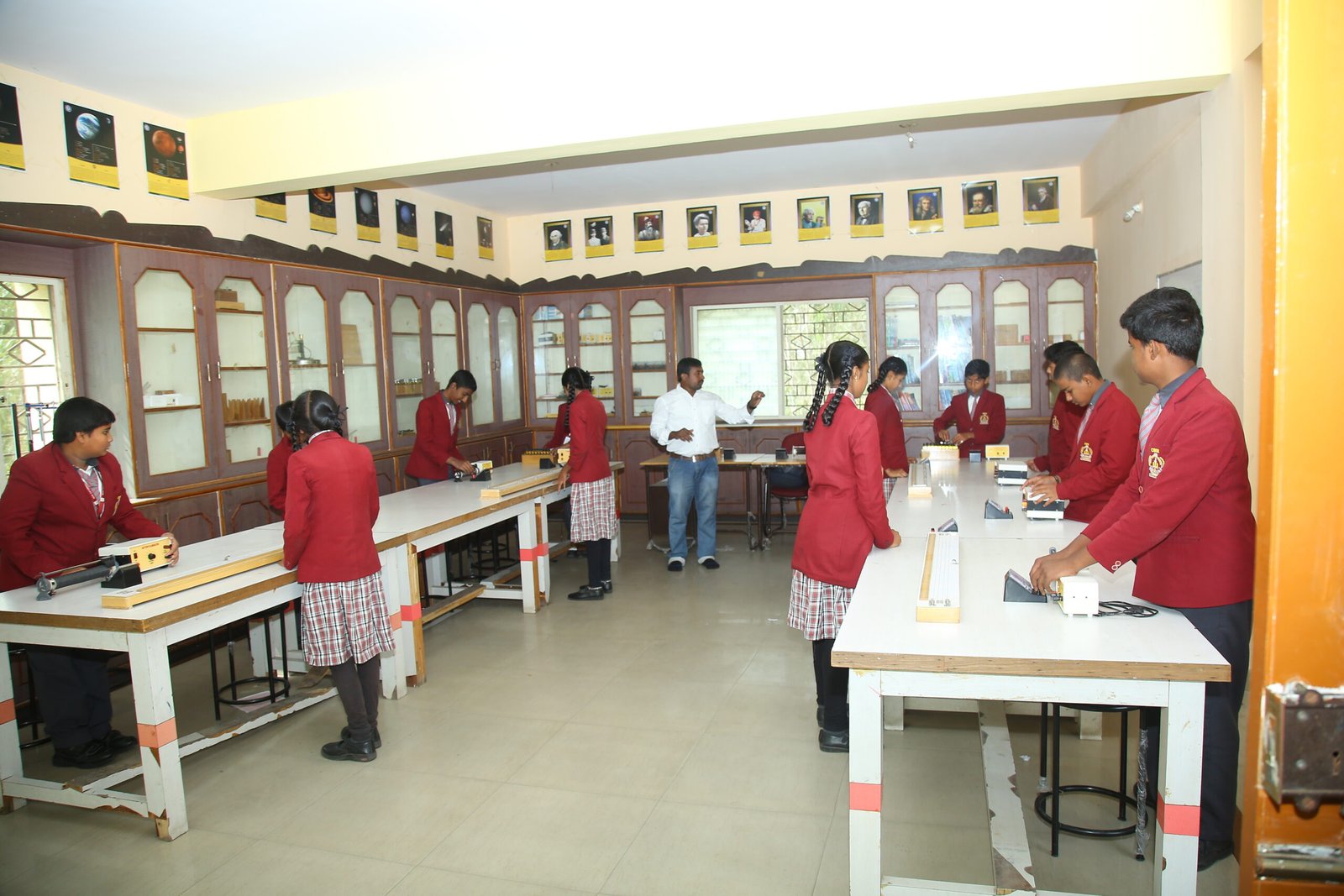 Secondary students doing an experiment in the science lab at New Oxford School