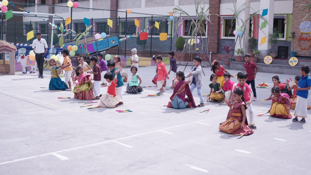  Vibrant depiction of Makar Sankranti celebration at a school, with enthusiastic participation in cultural activities.