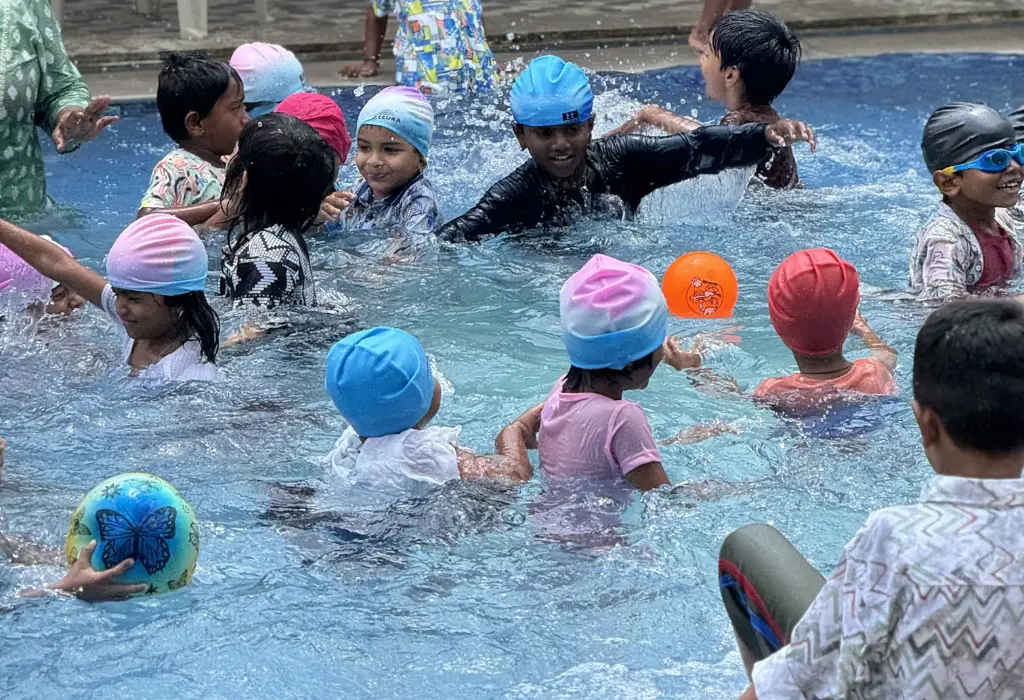 Kindergarten children in the swimming pool