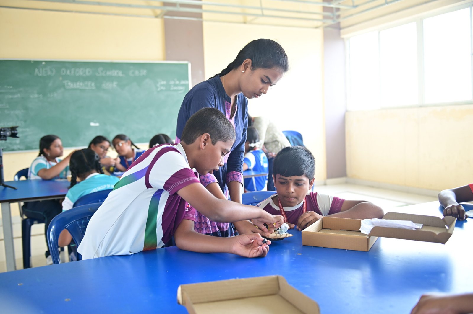Teacher helping children with reading