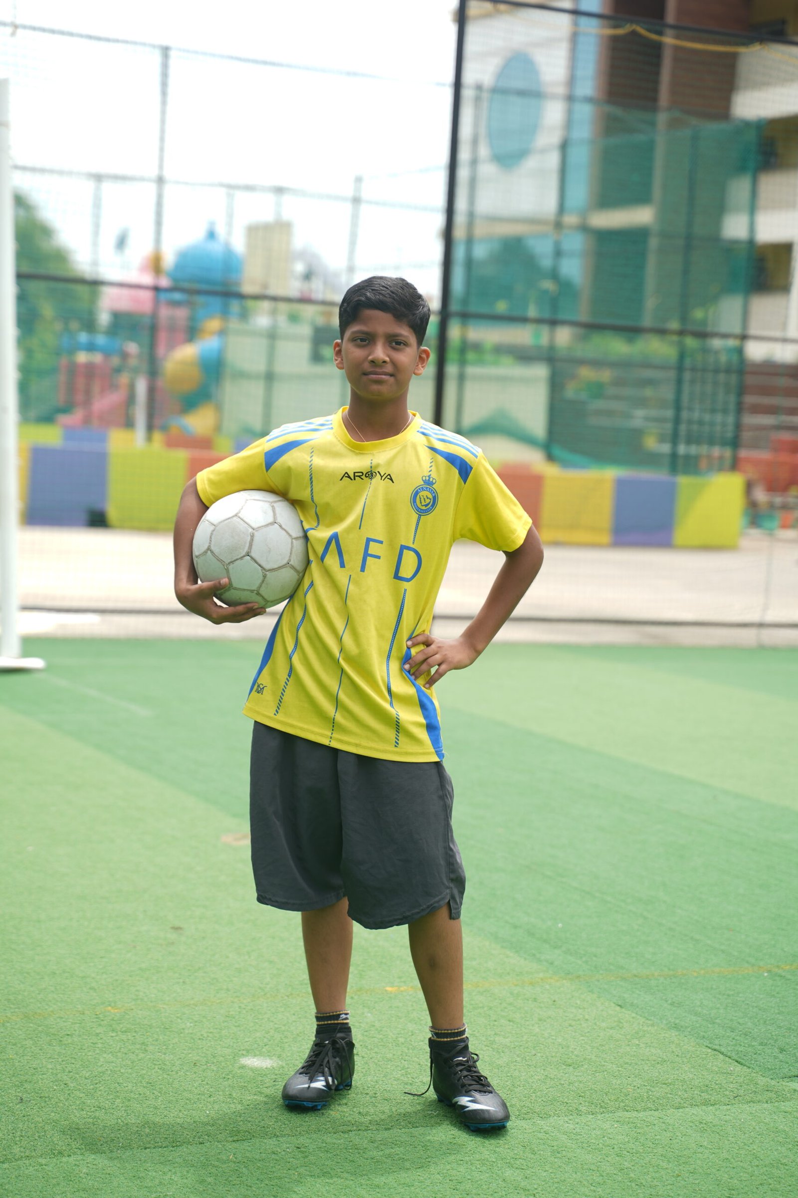 Secondary students holding the football